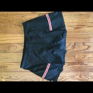 Black tennis skirt with red and white accents